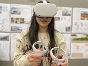 Appalachian State senior interior design student tests a VR set to wander through virtual spaces.
