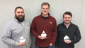 Rickey Bell, Myers Welborn and Nathan Haeme holding their trophies.