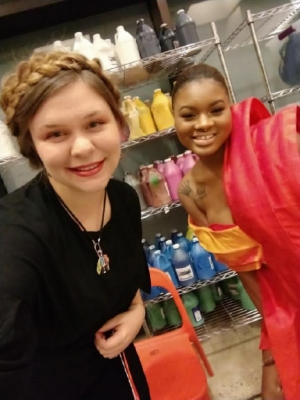 Appalachian State University student Sarah Bischoff poses backstage with a model wearing her design at the North Carolina Museum of Art's Ebony Fashion Fair runway show. Photo submitted