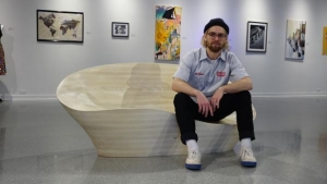 Walter Mingledorff, a senior industrial design major specializing in furniture design, with his 