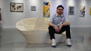 Walter Mingledorff, a senior industrial design major specializing in furniture design, with his "Best in Show" lounger, "I Lost my Multi-tool from Tupelo." Photo submitted